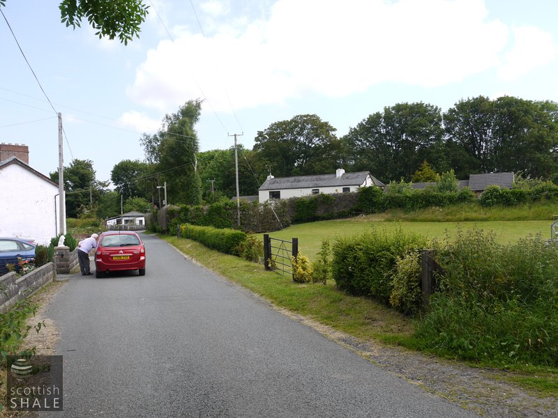 Padeswood - View towards "Railway Cottages", the trees behind marking the possible site of an oil works. June 2014